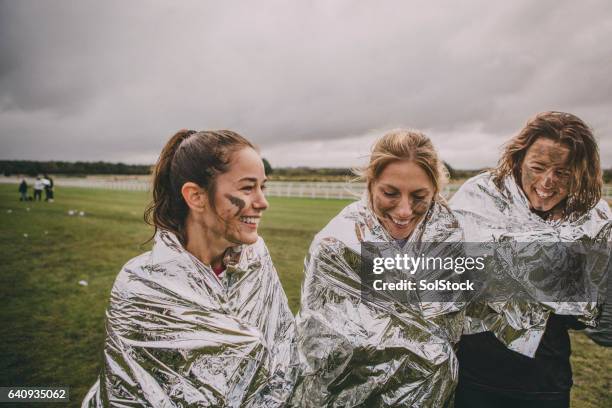 keeping warm after the race - finishing race stock pictures, royalty-free photos & images