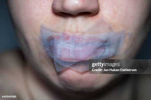 gagged woman - gagged woman stock pictures, royalty-free photos & images