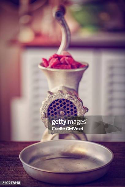 fresh minced meat in a mincer - meat grinder stock pictures, royalty-free photos & images