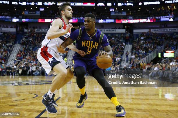 Terrence Jones of the New Orleans Pelicans drives against Tomas Satoransky of the Washington Wizards during the first half of a game at the Smoothie...