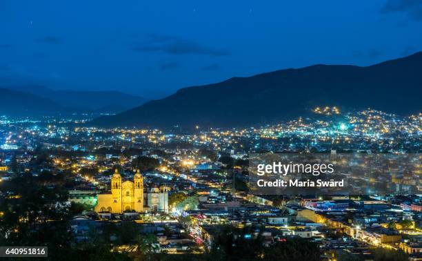 historic centre of oaxaca city with its landmark santo domingo church, mexico (part of unesco world heritage site) - oaxaca stock pictures, royalty-free photos & images