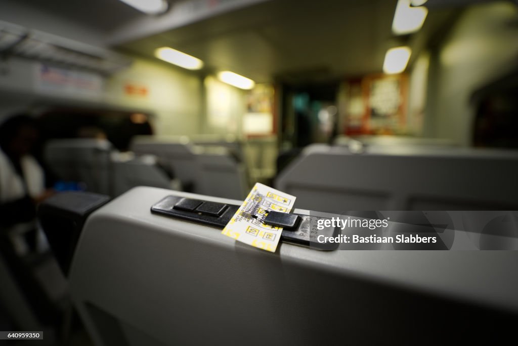 Philadelphia, PA, USA - February 2, 2017; A train ticket is held by a clip on a seat inside a railcar of a commuter train of the South Eastern Pennsylvania Transportation Authority (SEPTA)