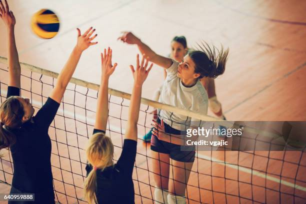 women in sport - volleyball - blocking sports activity stock pictures, royalty-free photos & images