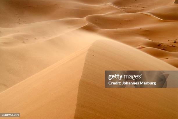 view of sand dunes in erg chebbi desert, morocco - sandstorm stock pictures, royalty-free photos & images