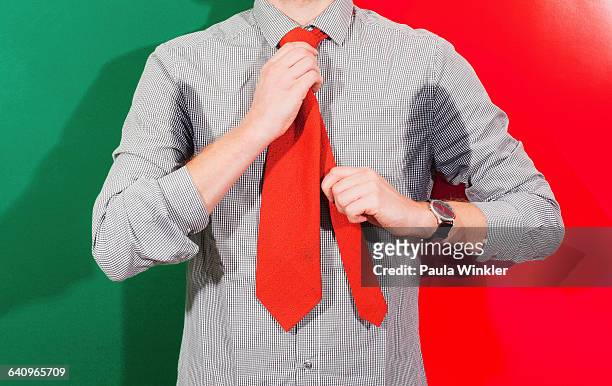 midsection of businessman with sweaty armpits wearing necktie against colored background - smelling armpit stock pictures, royalty-free photos & images
