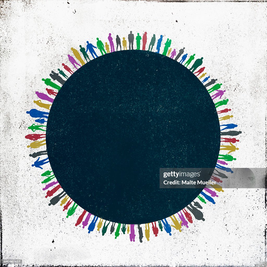 Multi colored people standing side by side around circle