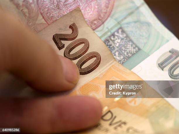 europe, czech republic, prague, view of person holding czech money (krone) - krona foto e immagini stock