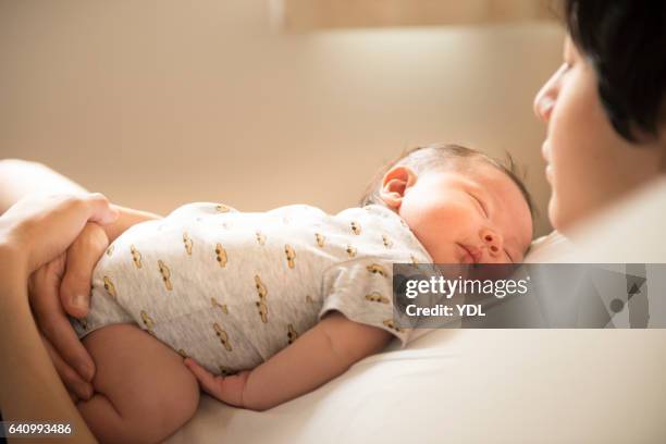 a baby and father. - baby father hug side stock-fotos und bilder