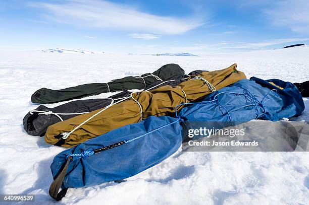 packed survival training course tents resting on the sea ice. - ross ice shelf stock pictures, royalty-free photos & images