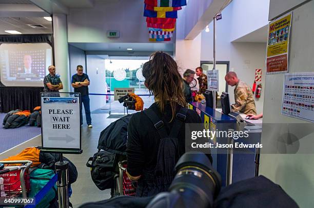 scientists waiting to clear customs to fly to antarctica. - passport control stock pictures, royalty-free photos & images