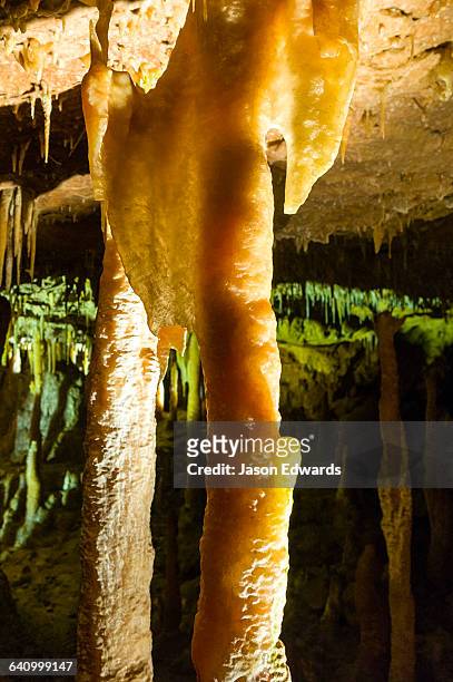 spectacular stalactites and stalagmites formed by water and mineral deposits decorate the caves. - stalactiet stockfoto's en -beelden