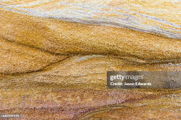 the wave surface on a sandstone beach rock. - sandstone stock pictures, royalty-free photos & images