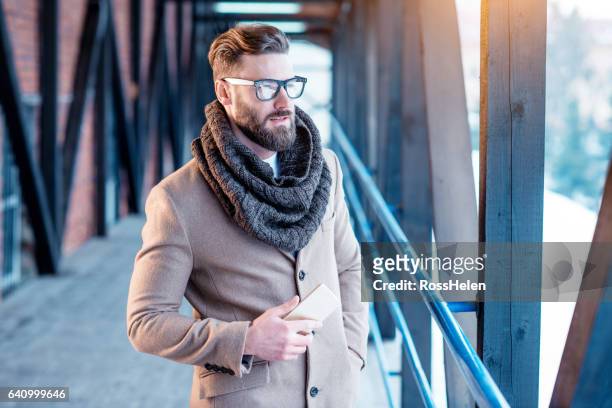 handsome man in winter elegant clothes outdoors - creative director stock pictures, royalty-free photos & images