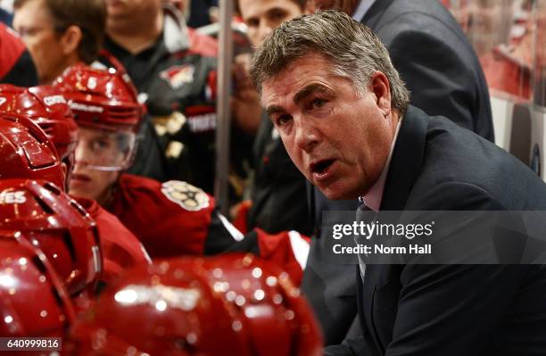 Head coach Dave Tippett of the Arizona Coyotes talks to his players on the bench during a game against the Chicago Blackhawks at Gila River Arena on...