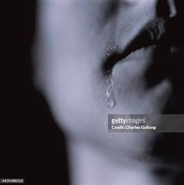 teardrop on woman's chin - painful lips stock pictures, royalty-free photos & images