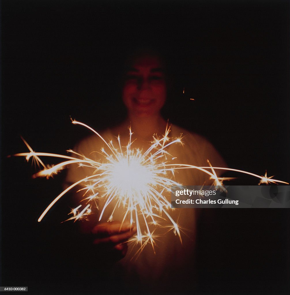 Woman Holding a Sparkler