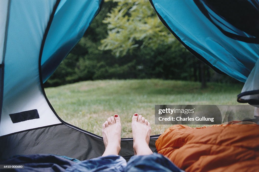 Feet Near Tent Opening
