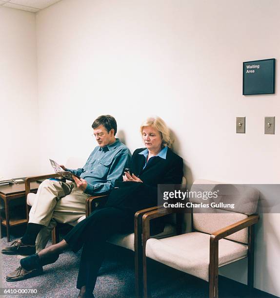 man and woman in waiting room - waiting room stock pictures, royalty-free photos & images
