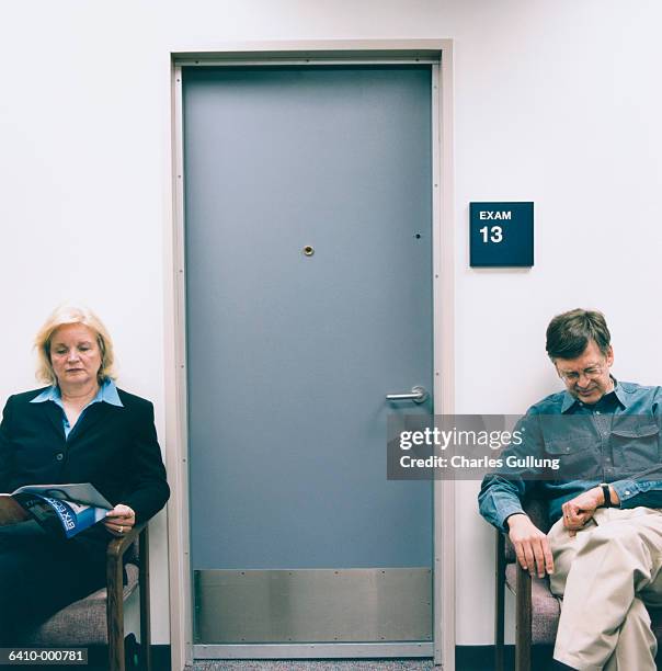 man and woman in waiting room - blocking door stock pictures, royalty-free photos & images
