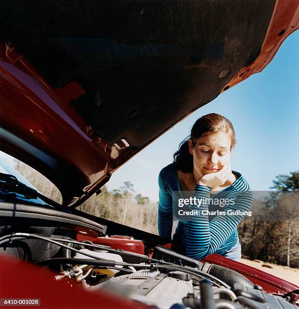 woman looking at car engine - vehicle breakdown bildbanksfoton och bilder