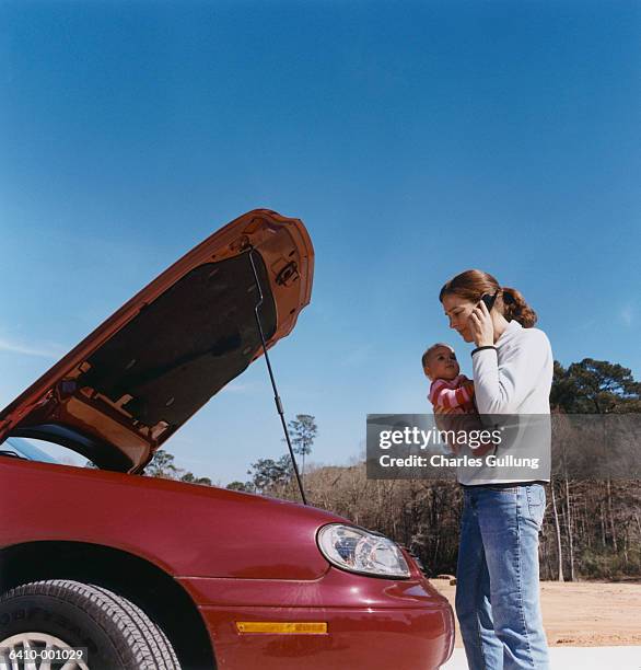 woman with baby and broken car - single mother stress stock pictures, royalty-free photos & images