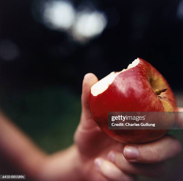 apple with bite mark - eaten foto e immagini stock
