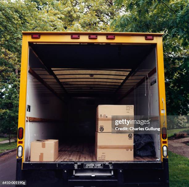 boxes in back of moving van - moving truck stock pictures, royalty-free photos & images