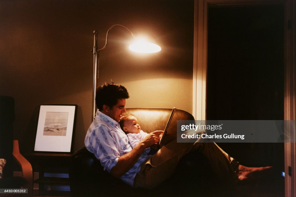 Father Reading to Baby