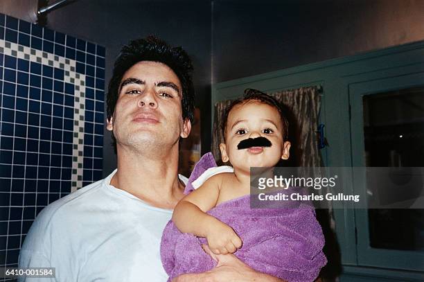 father and baby - practical joke fotografías e imágenes de stock