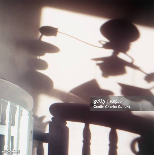 shadow of mobile over crib - wieg stockfoto's en -beelden