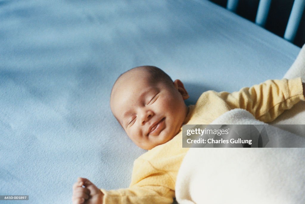 Smiling Baby in Crib