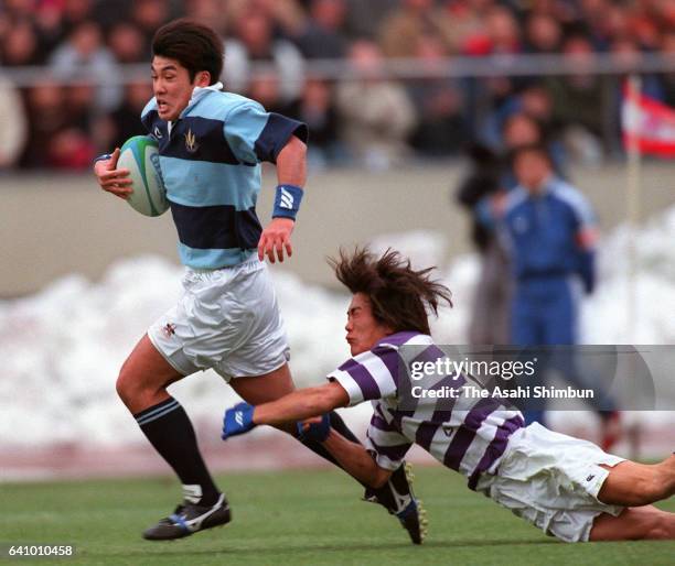 Soshi Fuchigami of Kanto Gakuin runs with the ball to score a try during the 34th All Japan University Rugby Championship final match between Kanto...