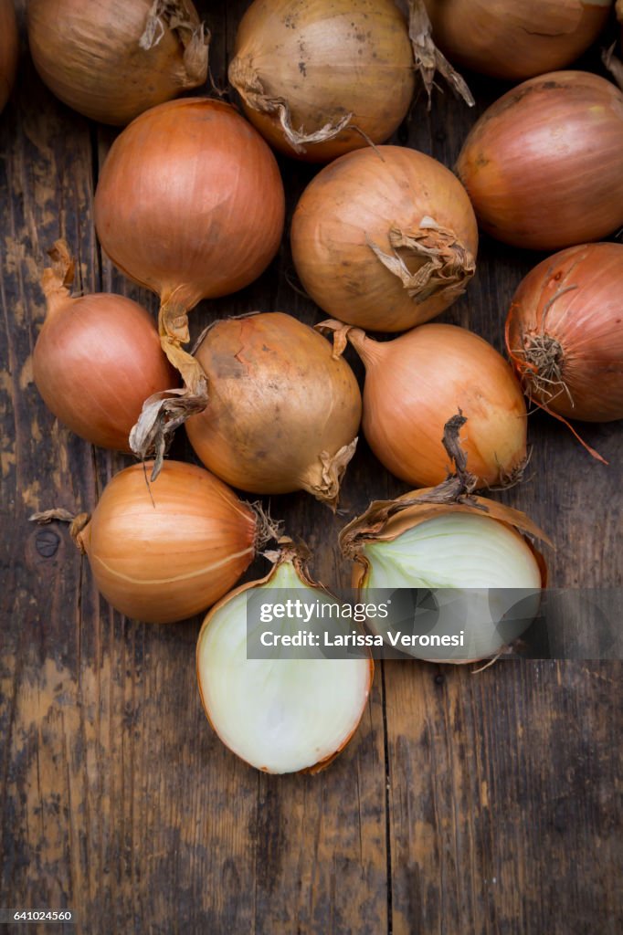Onions on dark wood