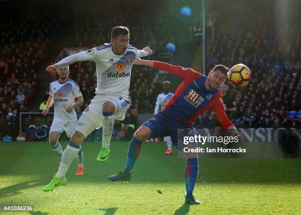 Joel Ward of Crystal Palace is tackled by Bryan Oviedo of Sunderland during the Premier League match between Crystal Palace and Sunderland at...