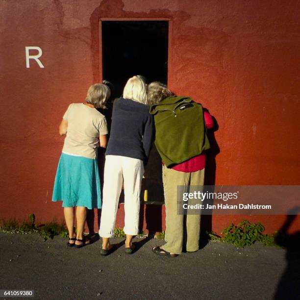 three women looking in a show window - on the outside looking in stock pictures, royalty-free photos & images