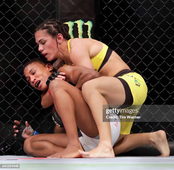 Jessica Andrade attempts a choke hold on Angela Hill in the Women's Strawweight Bout during UFC Fight Night at the Toyota Center on February 4, 2017...