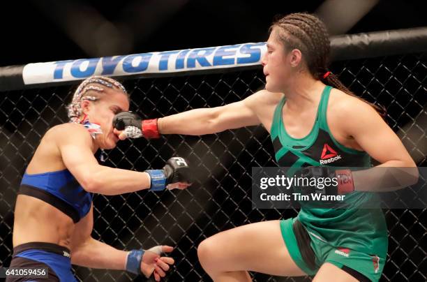 Alexa Grasso punches Felice Herrig in the Women's Strawweight Bout during UFC Fight Night at the Toyota Center on February 4, 2017 in Houston, Texas.