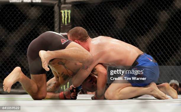 James Vick fights for position against Abel Trujillo in the Lightweight Bout during UFC Fight Night at the Toyota Center on February 4, 2017 in...