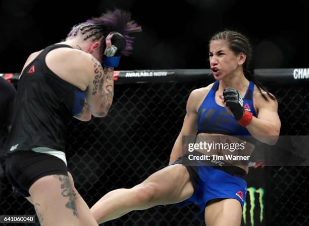 Tecia Torres kicks Bec Rawlings in the Women's Strawweight Bout during UFC Fight Night at the Toyota Center on February 4, 2017 in Houston, Texas.