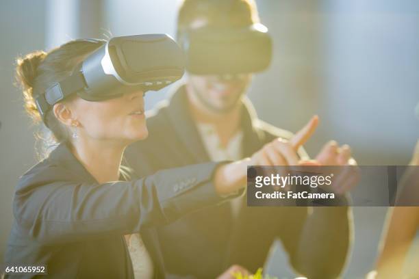 bringing vr to the office - digital audience stock pictures, royalty-free photos & images