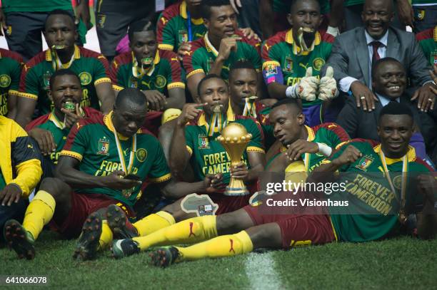 Holds the trophy as Cameroon celebrate winning the CAN 2017 FINAL between Cameroon and Egypt at Stade de L'Amitie on February 05, 2017 in Libreville,...
