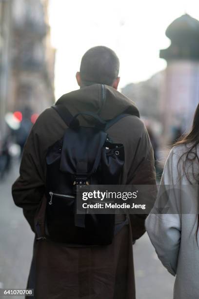 Guest wears an ALYX backpack outside the Y/PROJECT show on January 18, 2017 in Paris, France.