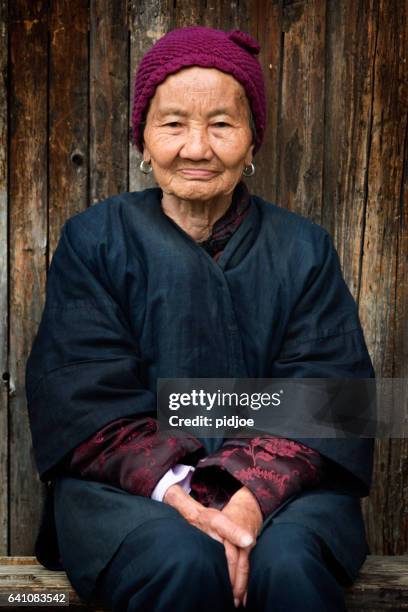 portrait of senior old dong people minority woman - tribal head gear in china stock pictures, royalty-free photos & images