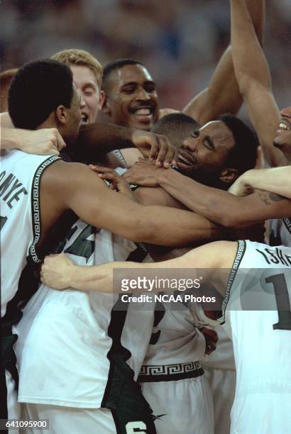 Tournament MVP Mateen Cleaves of Michigan State gets a team hug after clinching the title during the NCAA Photos via Getty Images Division I Men's...