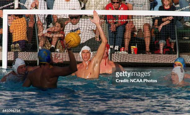 The University of California at San Diego team defends a shot on goal by UCLA's Matt Flesher during the Division I Men's Water Polo Championship held...