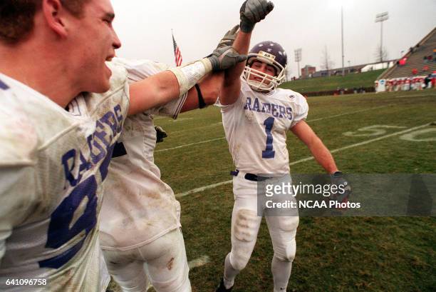 Kicker Rodney Chenos of Mount Union is congratulated after kicking the winning field goal to defeat St. John's University during the Division III...
