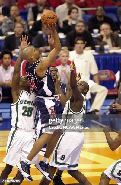 University of Arizona forward Richard Jefferson goes up over Michigan State center Zach Randolph and guard/forward Mike Chappell during the Division...