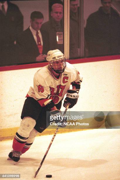 Derek Hahn of Rochester Institute of Technology carries the puck down ice during the 2001 NCAA Photos via Getty Images Men's Ice Hockey Championship...