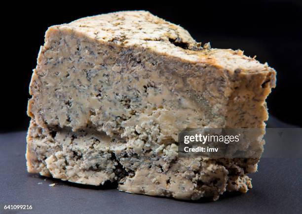 cabrales cheese in black background - blue cheese stock pictures, royalty-free photos & images