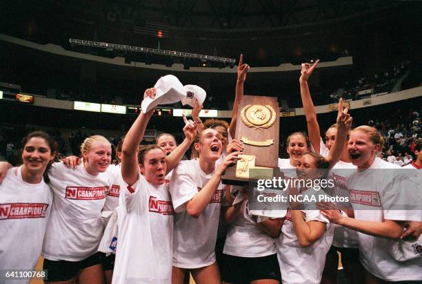 The Nebraska team celebrates their victory over Wisconsin during the Division 1 Women's Volleyball Championship held at the Richmond Coliseum in...